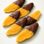 schokolierte Mango Vollmiclh Mango helle Glasur